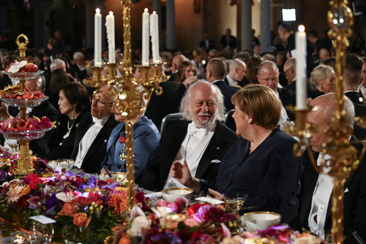 Krasznahorkai László és Angela Merkel